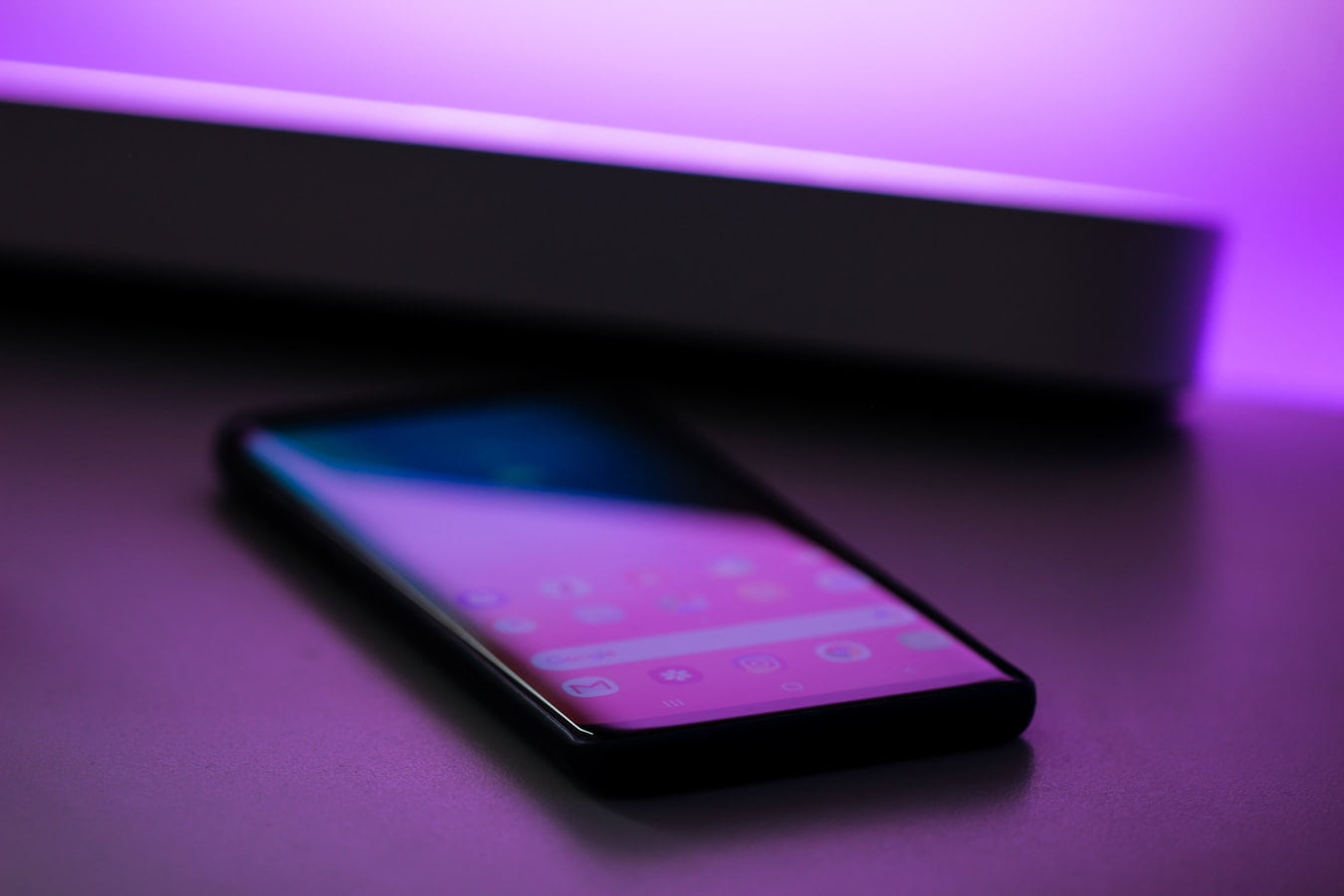 Phone on desk with glare