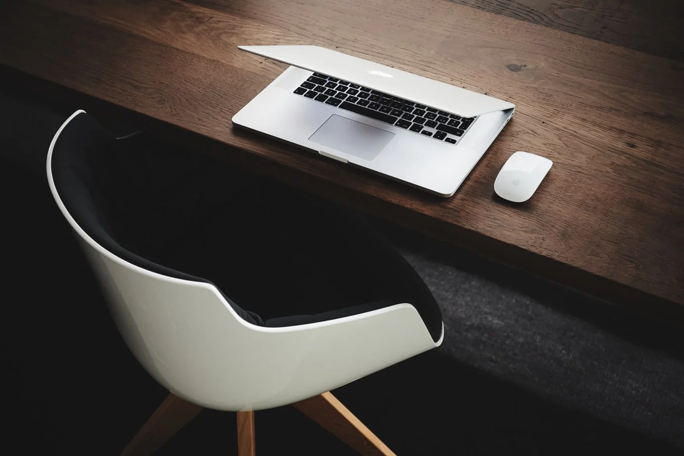Desk with Macbook and mouse