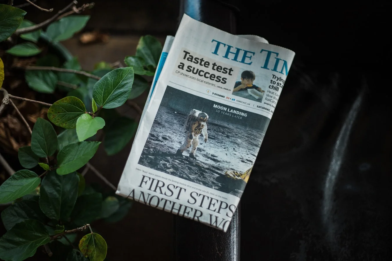 Newspaper folded on couch
