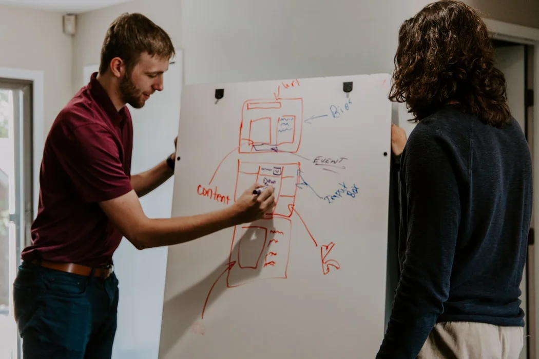 Man writing on whiteboard