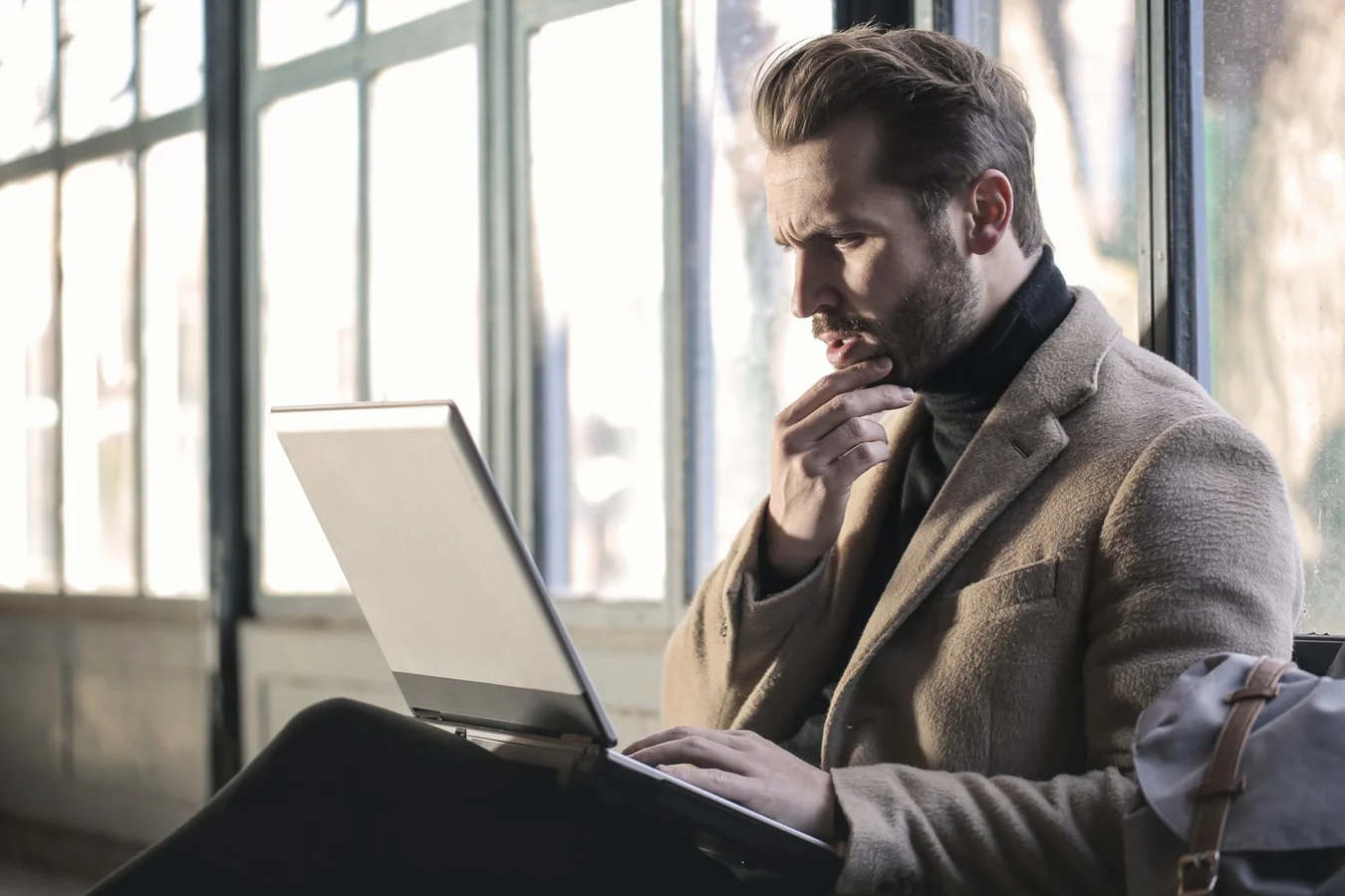 Man reading copywriting client questionnaire