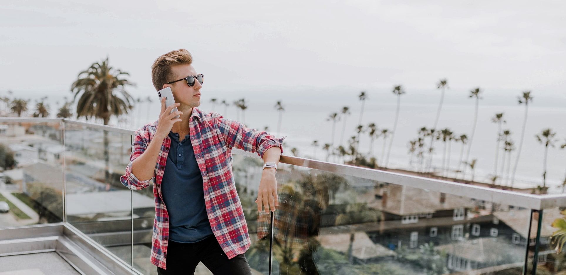 Talking on phone on balcony