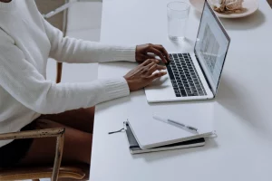 Woman on laptop blogging