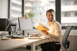 Man working at desk smiling