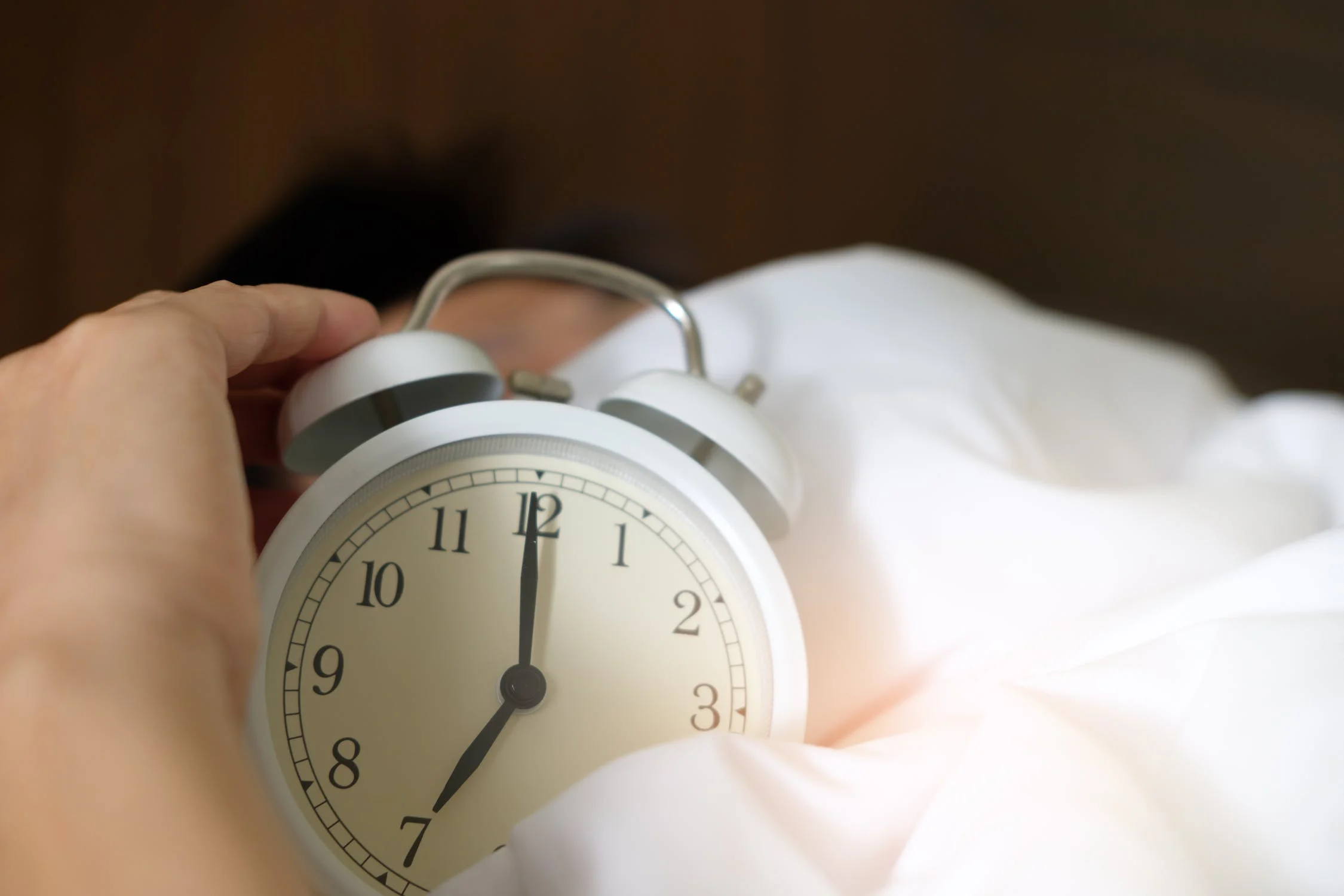 Alarm clock on bed