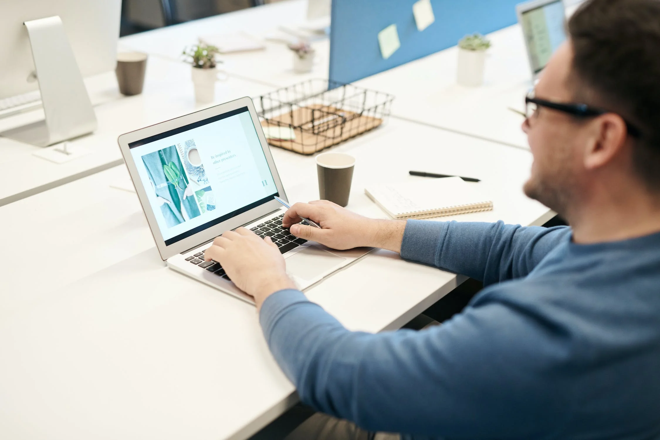 Writing email copy on laptop