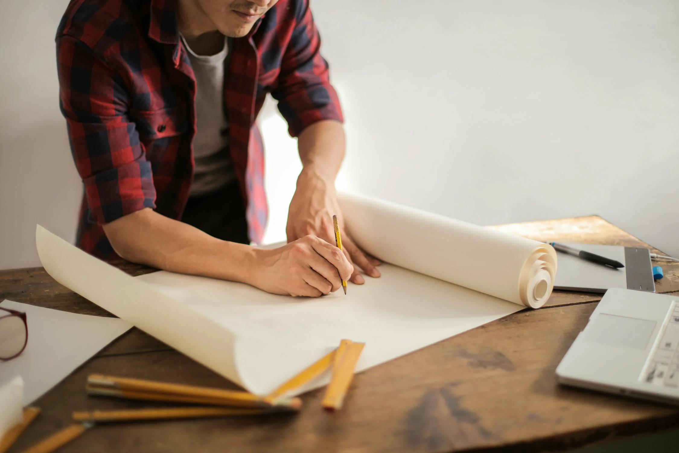Man working on blueprint