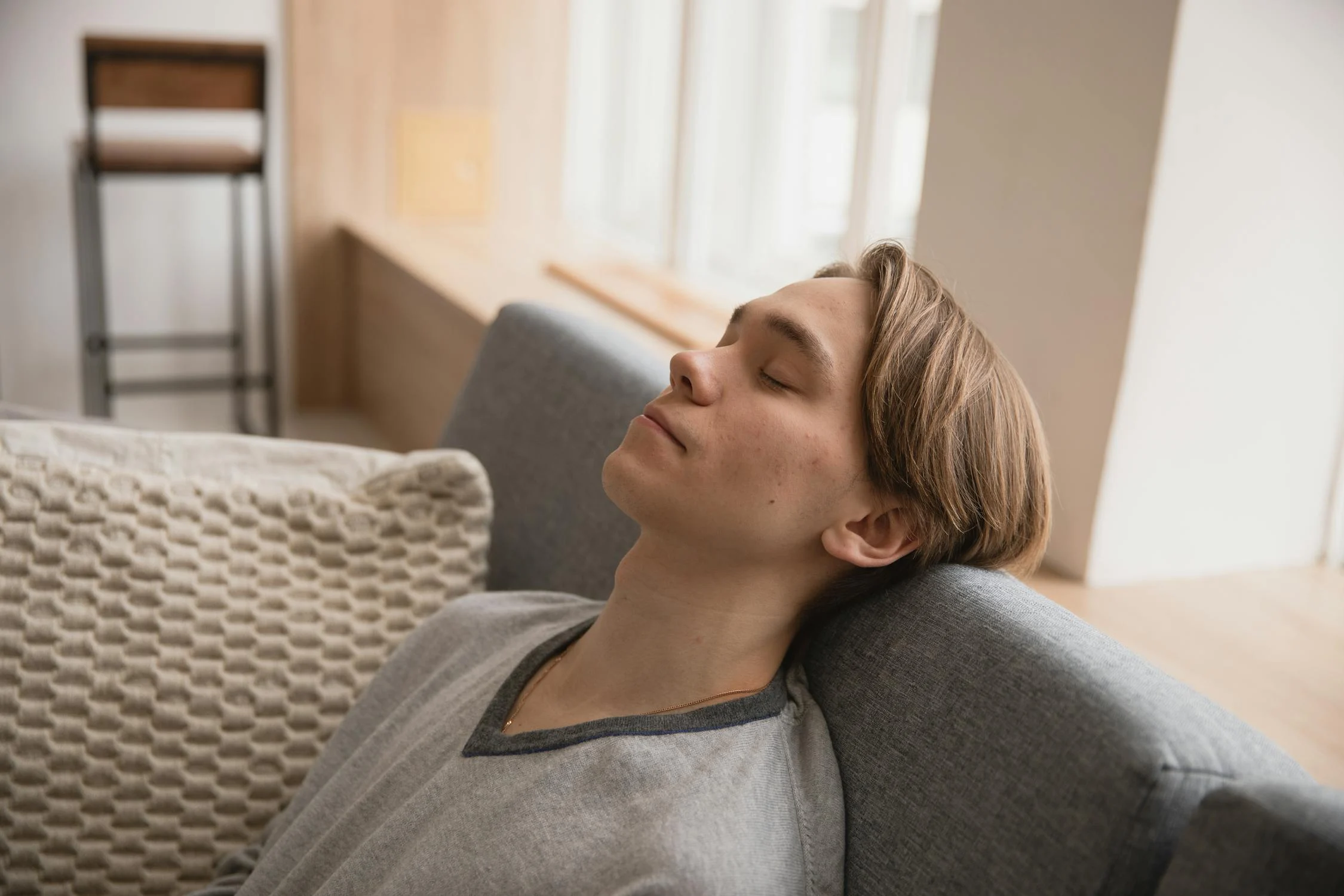 Young man sleeping on couch