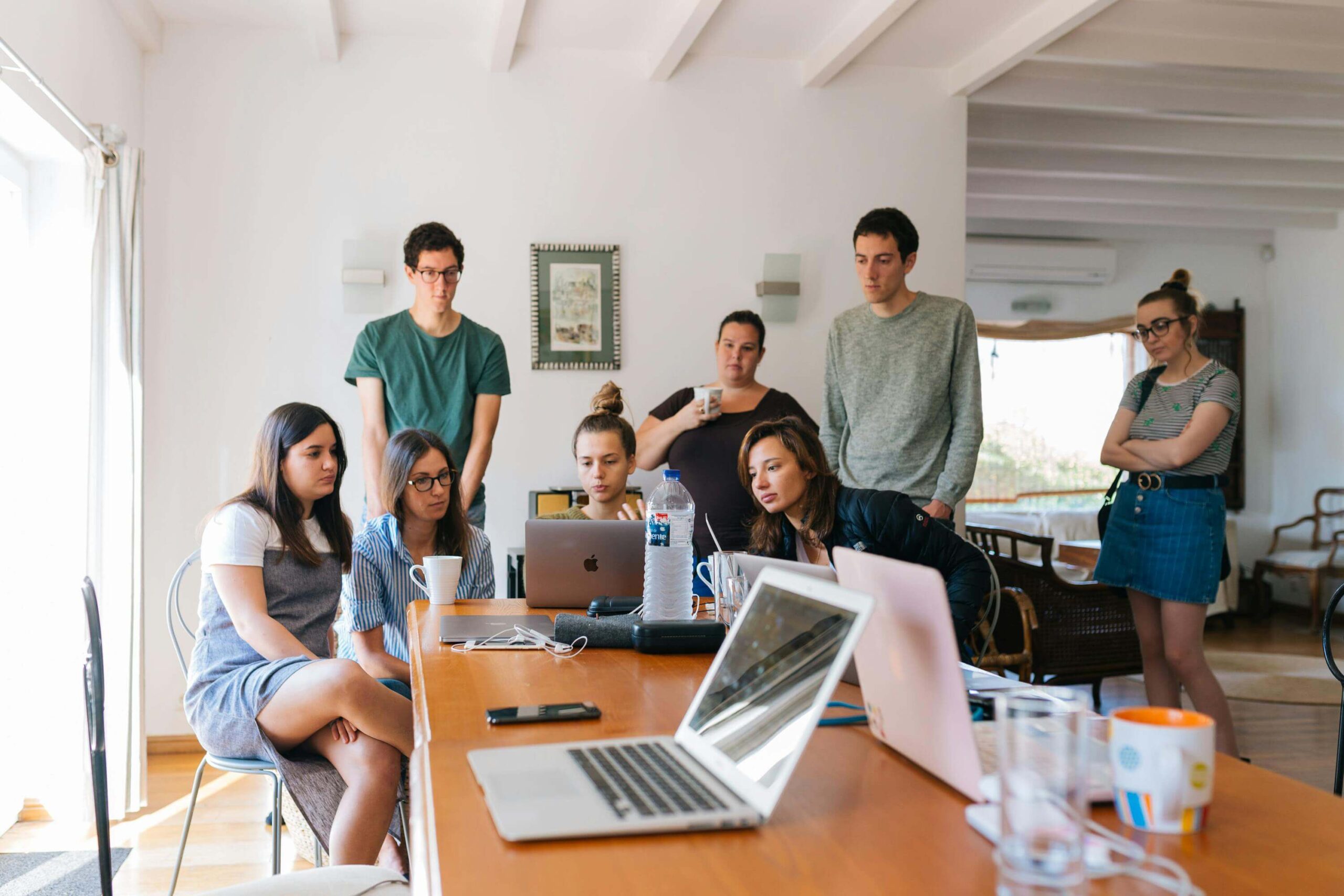 Employees working around desk