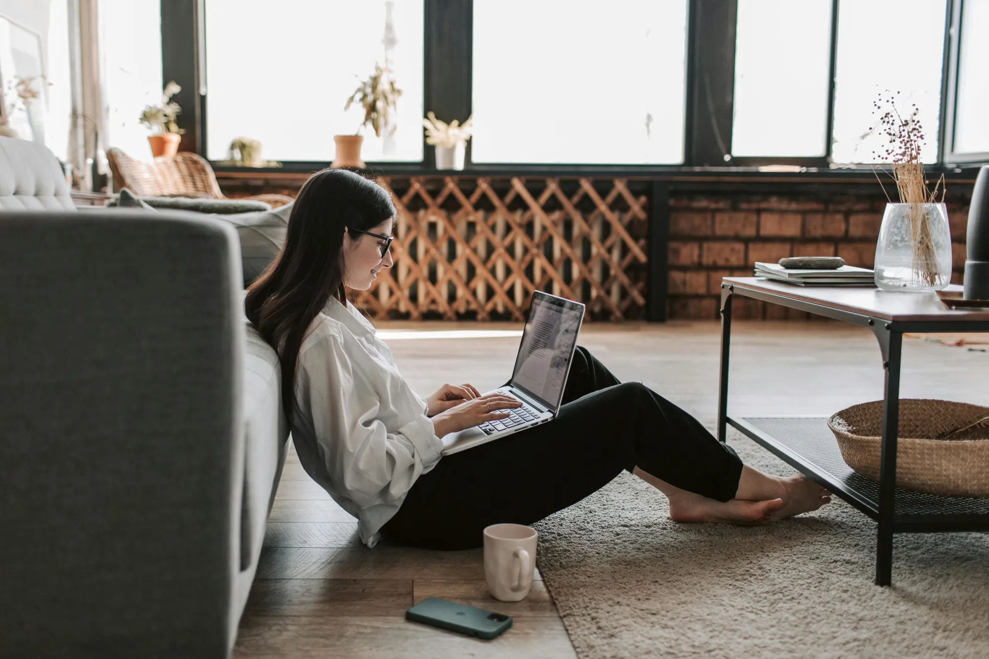 Woman working on floor with laptop