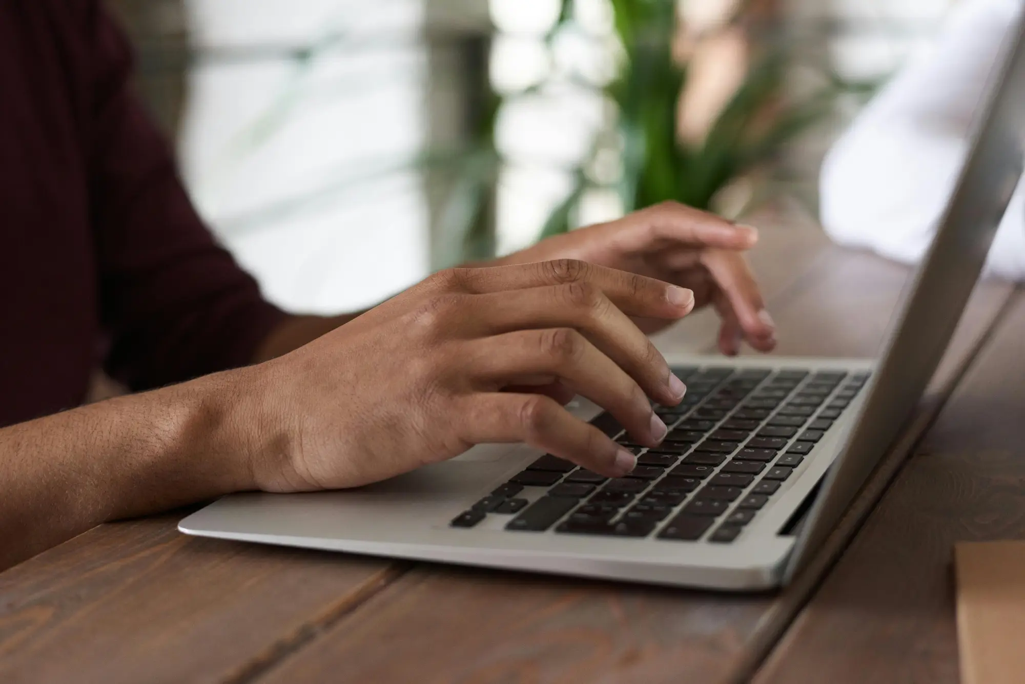 Person writing copy on their laptop